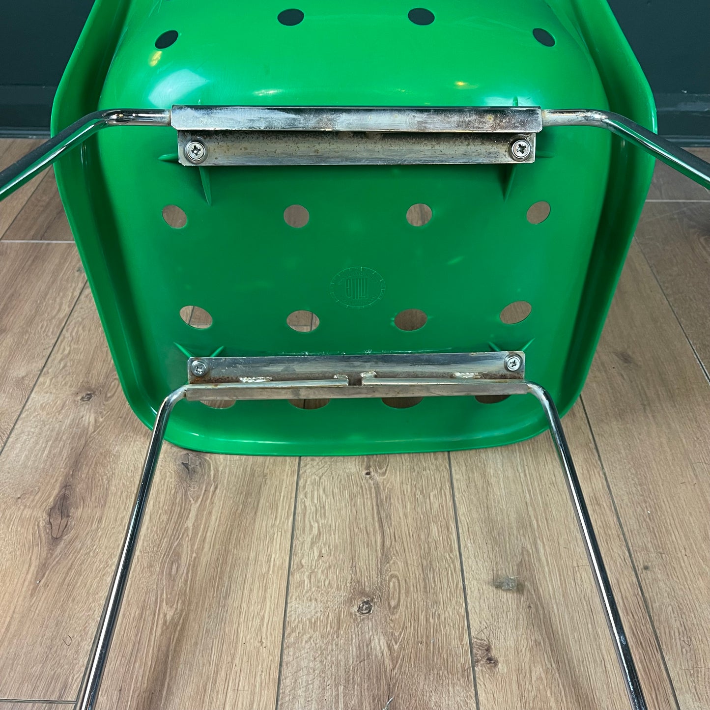 Green vintage Robin Day Polo chair with chrome legs