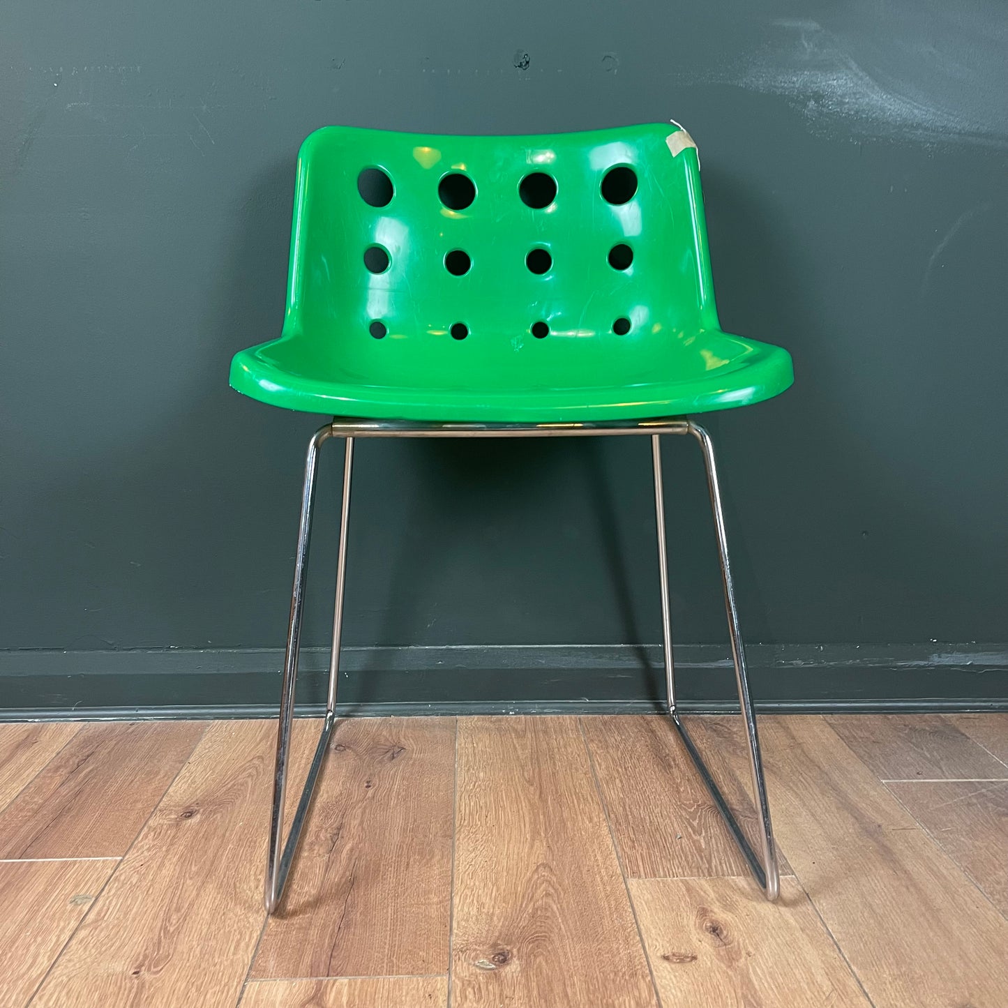 Green vintage Robin Day Polo chair with chrome legs