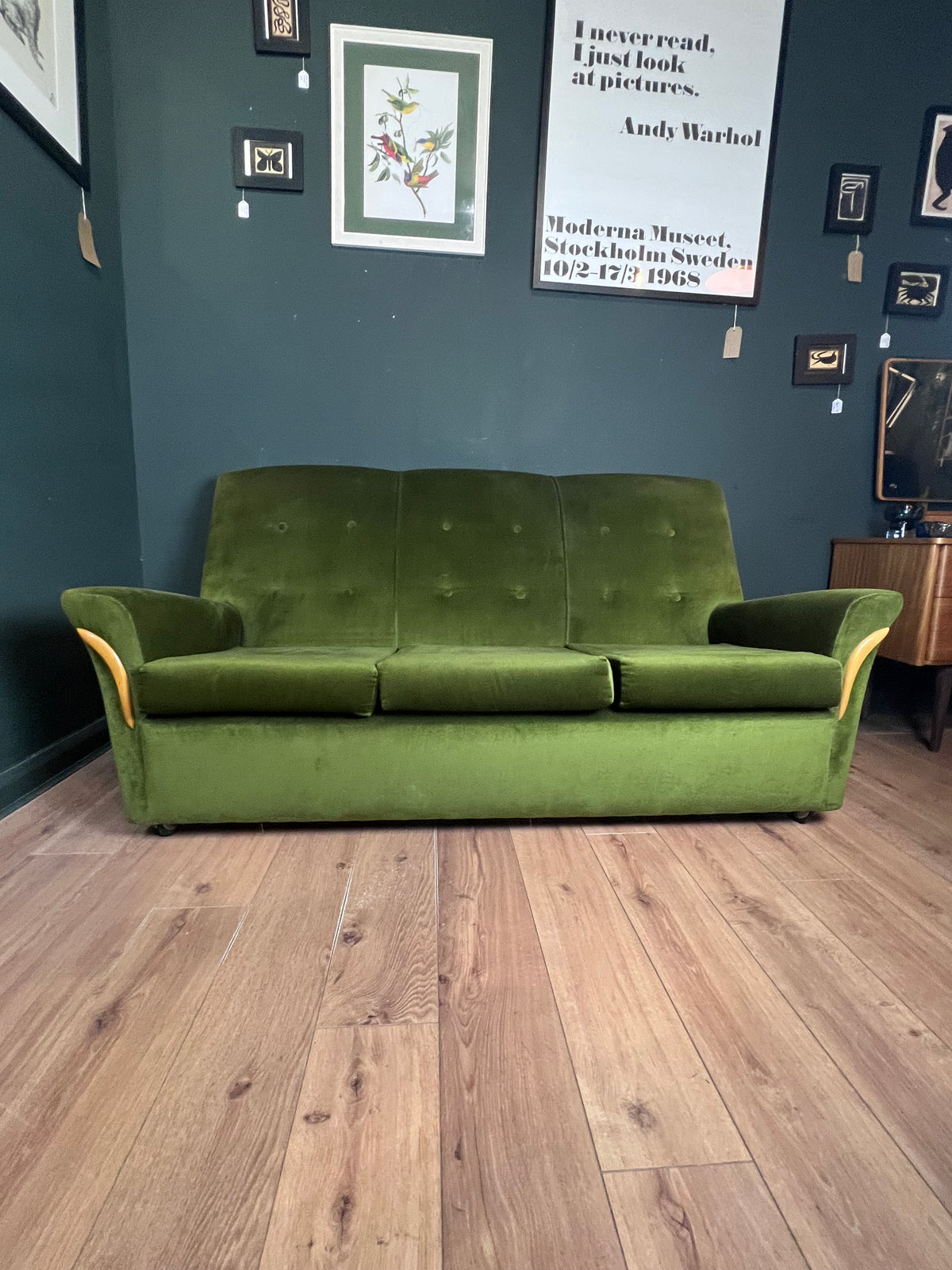 1960s moss green three seater  sofa with woodenboomerang arm detail