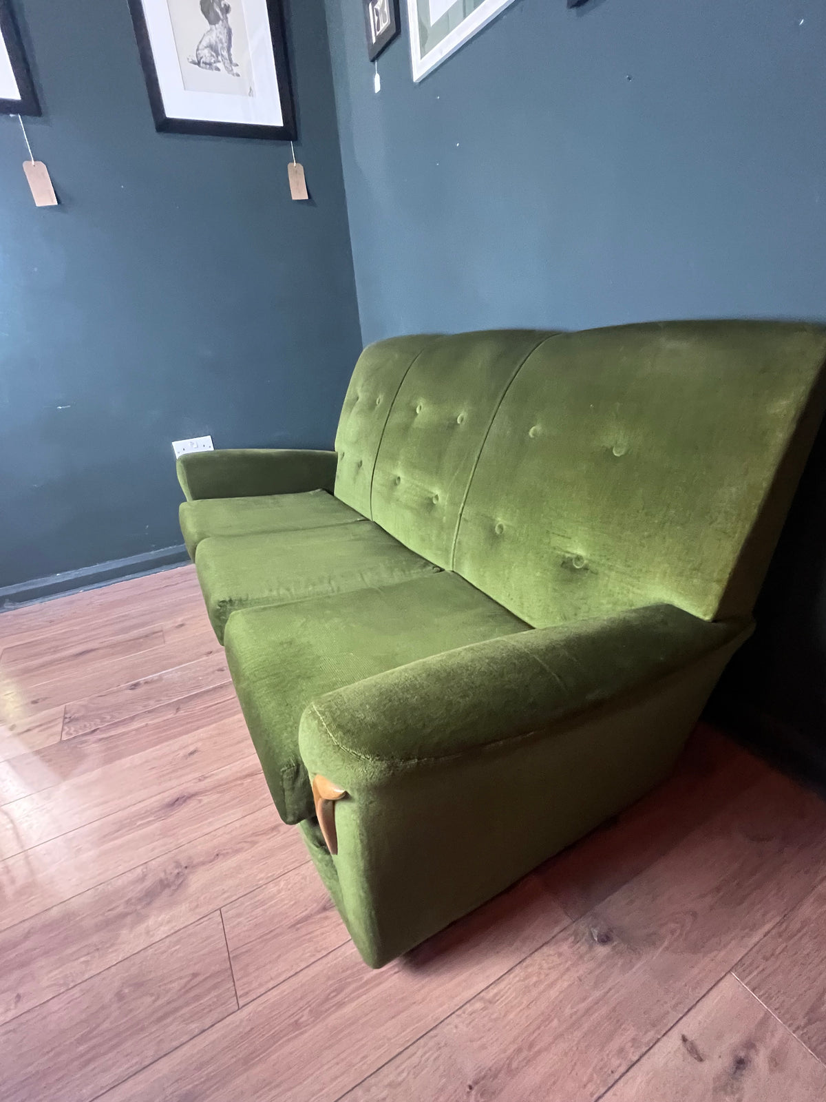 1960s moss green three seater  sofa with woodenboomerang arm detail