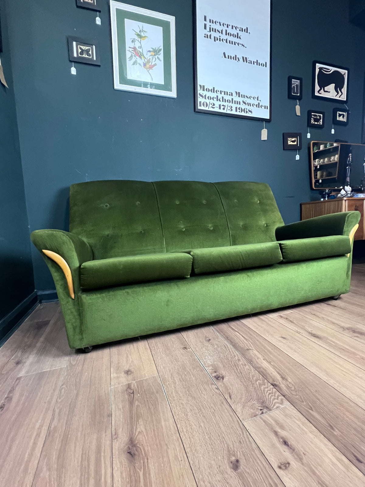 1960s moss green three seater  sofa with woodenboomerang arm detail
