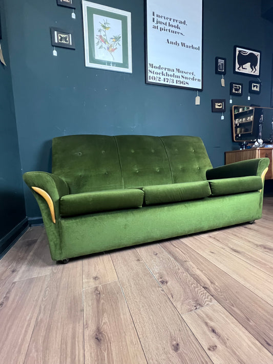 1960s moss green three seater  sofa with woodenboomerang arm detail