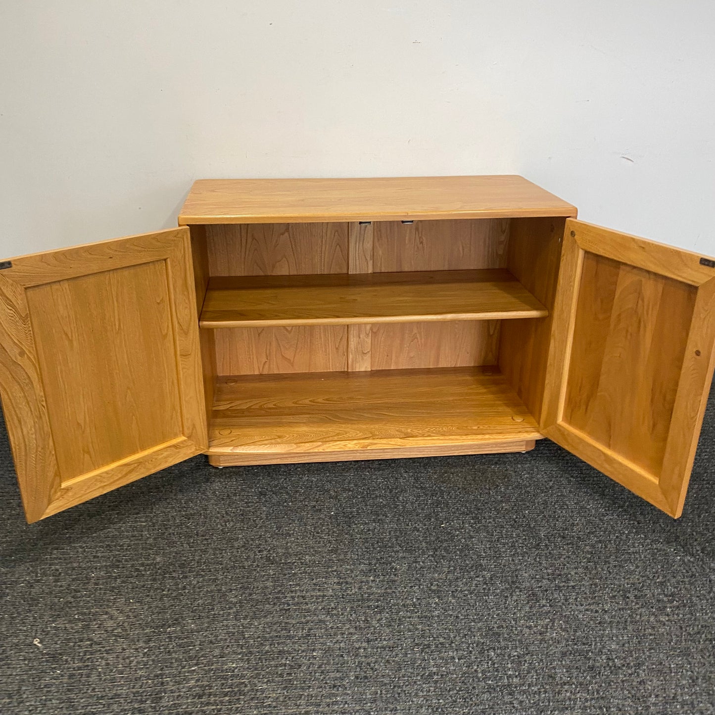 Ercol 2 door cabinet #1013 solid elm. Excellent condition.