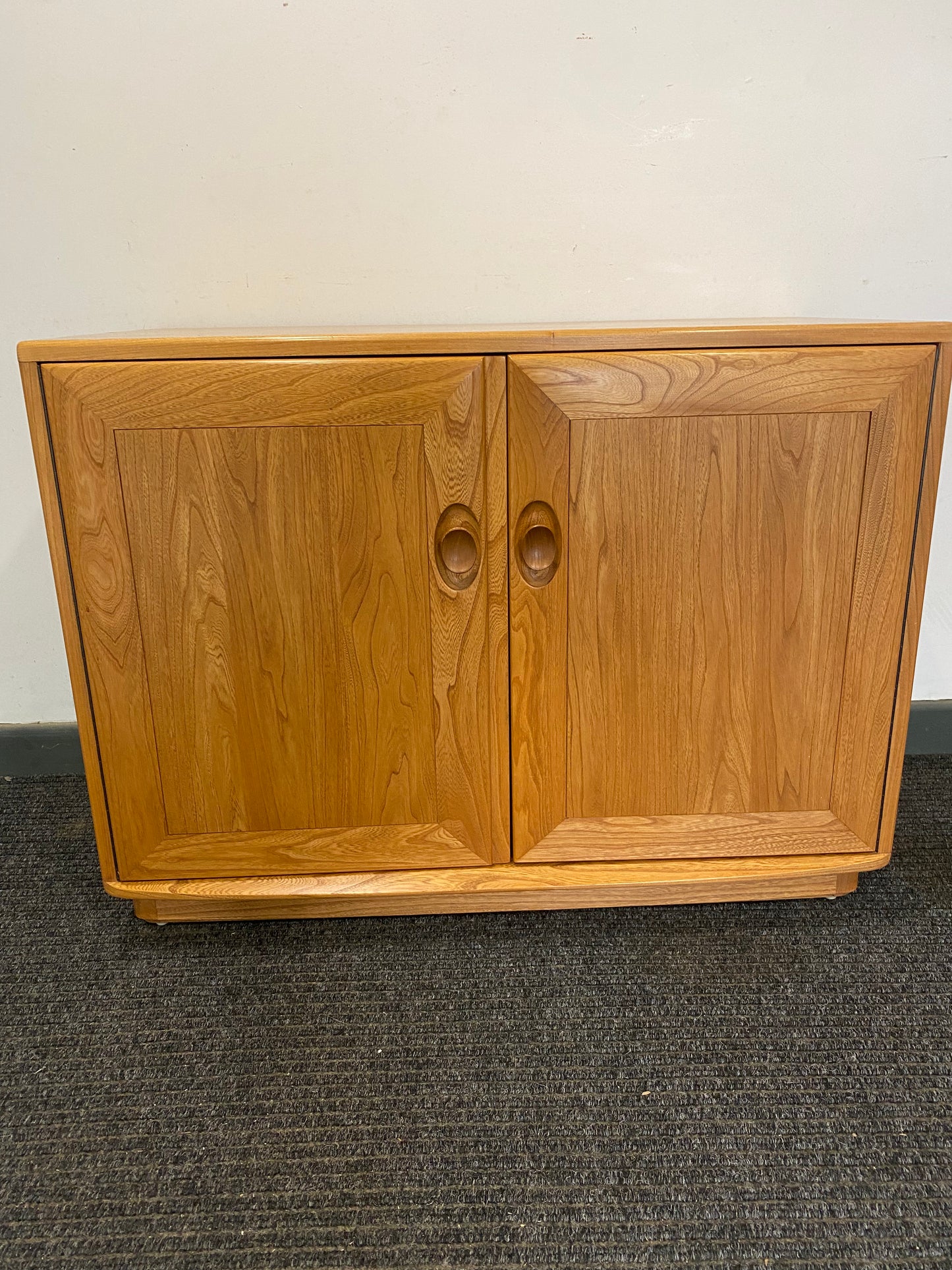 Ercol 2 door cabinet #1013 solid elm. Excellent condition.