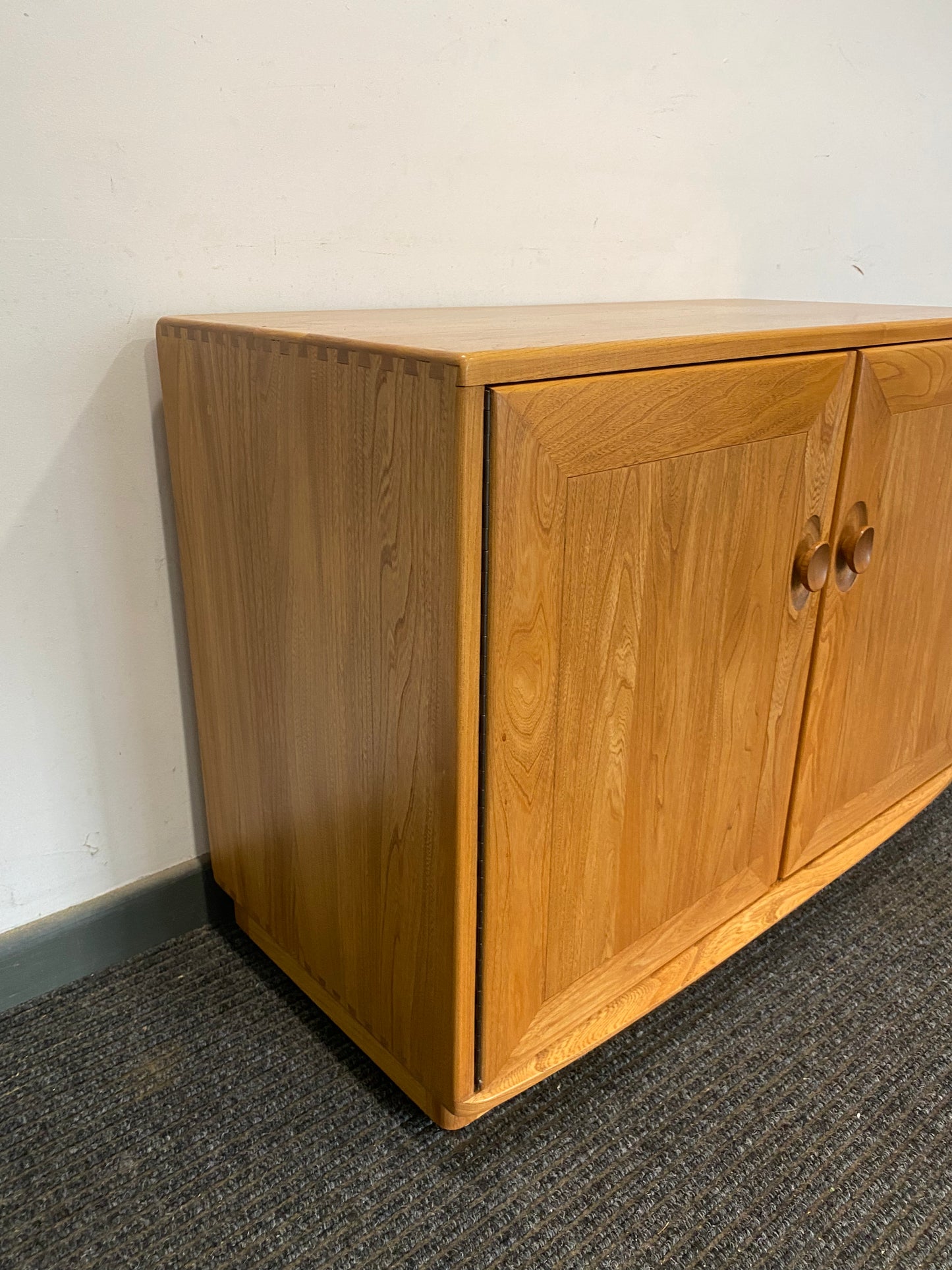 Ercol 2 door cabinet #1013 solid elm. Excellent condition.