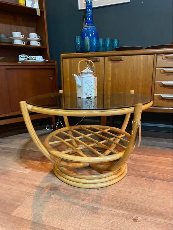 Round vintage bamboo coffee table with a smoked glass top