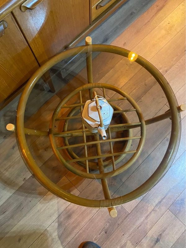Round vintage bamboo coffee table with a smoked glass top
